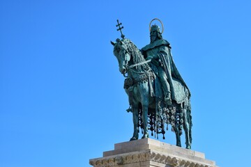 Obraz premium Statue of St Stephen represents the first king of Hungary seated on a destrier, wearing the Hungarian crown and the coronation mantle.