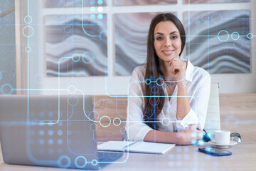 Attractive businesswoman in white shirt at workplace working with laptop to optimize development by...