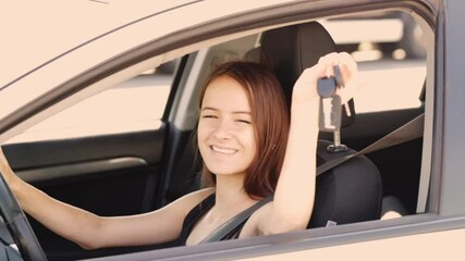 girl with car keys, buying and renting a car on credit,a happy woman at the wheel