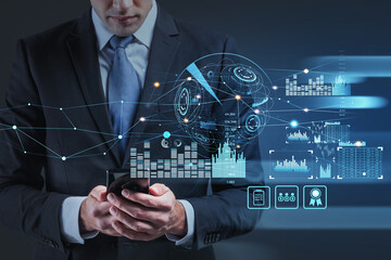 Ambitious businessman in formal suit is holding the smart phone and touching the screen. Concept of analyzing financial situation on stock market. digital financial interface with huds and bar charts