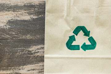 Green recycle symbol on paper cardboard background, Eco friendly and sustainability concept