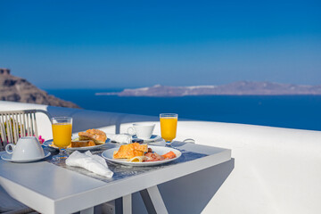 Morning fresh juice and breakfast with blue sea view. Couple traveling and honeymoon destination,...