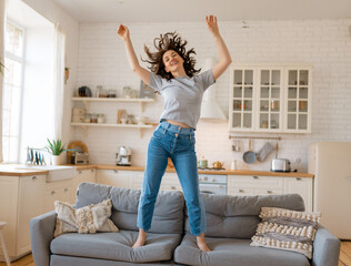 woman jumping on the sofa