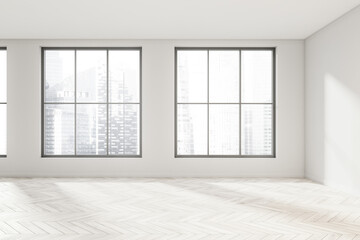 Empty white room space with light wood floor and windows