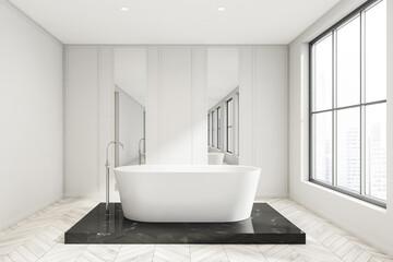 Fototapeta na wymiar White bathroom space with black platform and ceramic bathtub