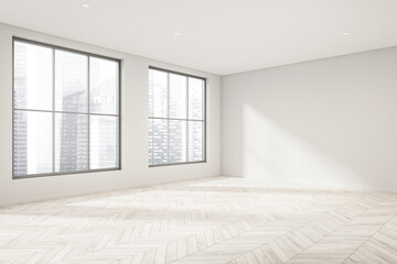 Empty white room with light wood floor and windows. Corner view.