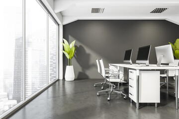 Panoramic office room with white desk, grey floors and squared lights