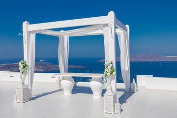 Wedding decorations with minimal white details on the background of the sea, Greece, Santorini. Luxury destination wedding. romantic couple travel vacation background