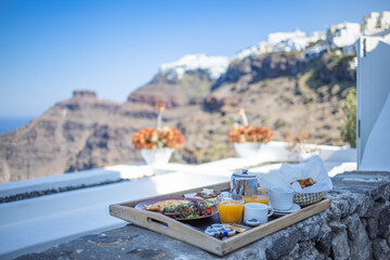 Morning fresh juice and breakfast preparation. Couple traveling and honeymoon destination, idyllic...