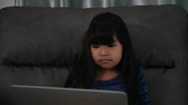 Asian little girl learn online at home,In the era of the Covid-19 epidemic, it is not possible to go to school normally.