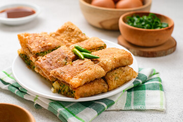 Martabak Telor or Martabak Telur. Savory pan-fried pastry stuffed with egg, meat and spices.