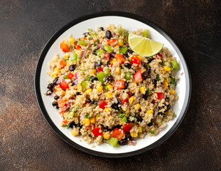 Quinoa black bean salad with corn, red green pepper, onion. Healthy food.