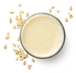 Glass of vegan oat milk isolated on white background