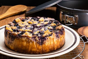 Side view closeup of freshly baked delicious homemade blueberry and crumble cheesecake.