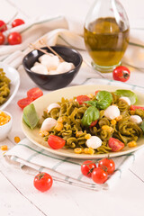 Fusilli pasta with cherry tomatoes and sweet corn.