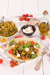 Fusilli pasta with cherry tomatoes and sweet corn.