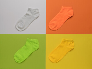 Four multi-colored socks on a four-color background.