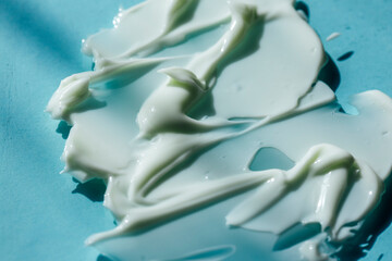 Fototapeta na wymiar Beauty skincare cream texture. White lotion, moisturizer, creamy cosmetic product background 