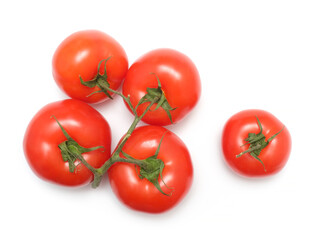 red tomato vegetable on green branch