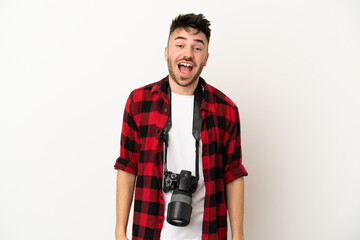 Young photographer caucasian man isolated on white background with surprise facial expression