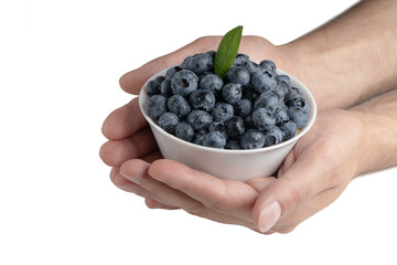Blueberries in bowl with water drops in hands on white