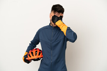 Young cyclist man isolated on white background covering eyes by hands. Do not want to see something