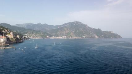 Panoramic aerial view of Amalfi coastline from a moving drone, Campania - Italy.