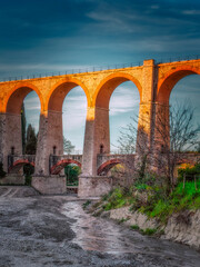 Fototapeta na wymiar Ancient railway bridge built in bricks