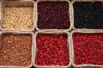 A set of dried fruits and nuts. The counter is on the market with dried fruits and nuts