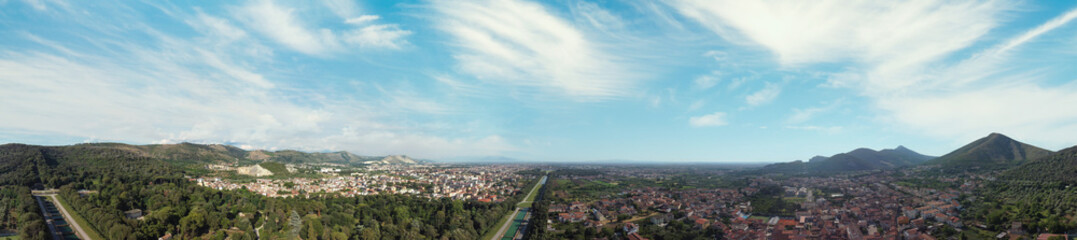 Famous royal palace of Caserta at sunset, panoramic aerial view from a drone viewpoint.