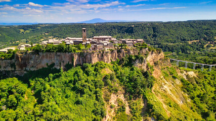 Panoramic aerial view of Civita di Bagnoregio from a flying drone around the medieval city, Italy.