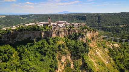 Fototapeta na wymiar Panoramic aerial view of Civita di Bagnoregio from a flying drone around the medieval city, Italy.