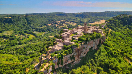 Fototapeta na wymiar Panoramic aerial view of Civita di Bagnoregio from a flying drone around the medieval city, Italy.