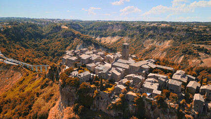 Approaching medieval town of Civita di Bagnoregio from a drone, Italy.