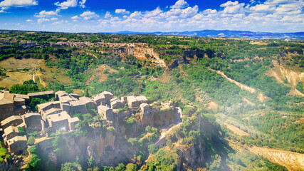Approaching medieval town of Civita di Bagnoregio from a drone, Italy.