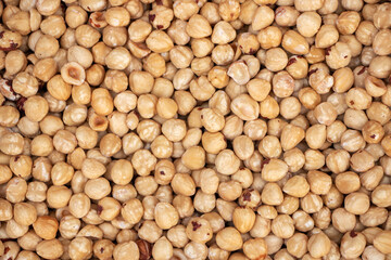 Hazelnut Background. Heap of peeled hazelnuts.