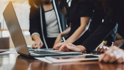 Young professionals team of businesswoman talking on a meeting in modern creative office analyzing...