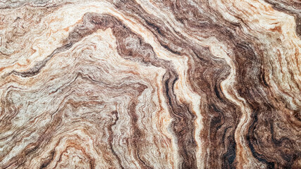 The surface of Sandstone with wavy brown veins. Sulphide agate texture. Wide image of brown natural...
