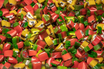 Fototapeta na wymiar Multicolored jelly stick candies textured background