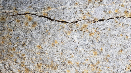 surface of the marble with brown tint. Details of sand stone texture, close up shot of rock surface with vignette at cover and bright spot at centre, idea for background or backdrop.