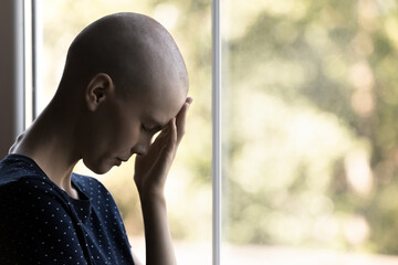 Sad exhausted cancer patient suffering prom pain, feeling tired, depressed, disappointed, hopeless....