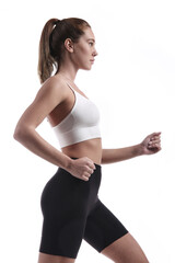 Portrait of a running sportive woman. Isolated over white background.