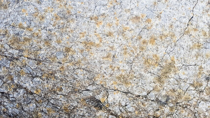 stone texture or background. Coarse cracked stone structure of the face. empty gray stone texture or background