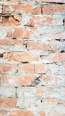 Background of red brick wall near pattern texture. A sample photo of a vertical wall with bricks and cement. Vertical photo for social networks.