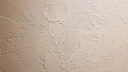 Light textured plaster as a background. Decorative plaster effect on wall. Textured background. Decorative plaster walls, external decoration of facade. Texture of beige.