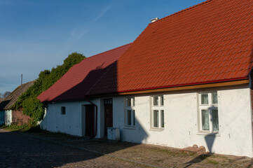 Fototapeta na wymiar Old house with new tiled roof. Studzienna Street. Czaplinek, Poland.