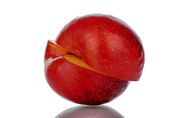 Two half of ripe fragrant red plum, close-up, isolated on white.