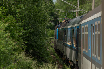 Naklejka premium Electric engine and blue coach from window