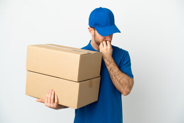 Delivery man over isolated white background having doubts