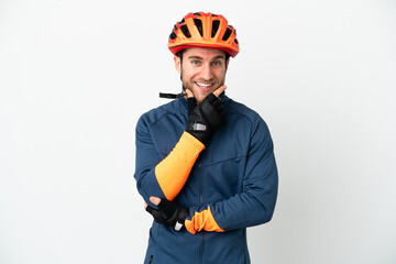 Young cyclist man isolated on white background happy and smiling